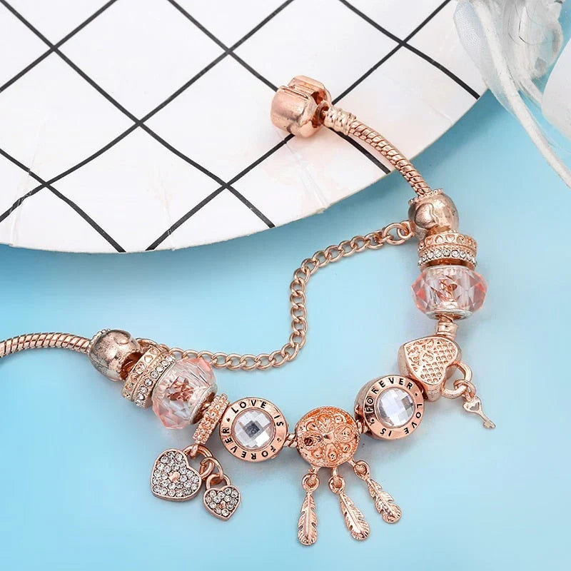 Bracelet attrape-rêves rose avec breloques incluses en argent sterling