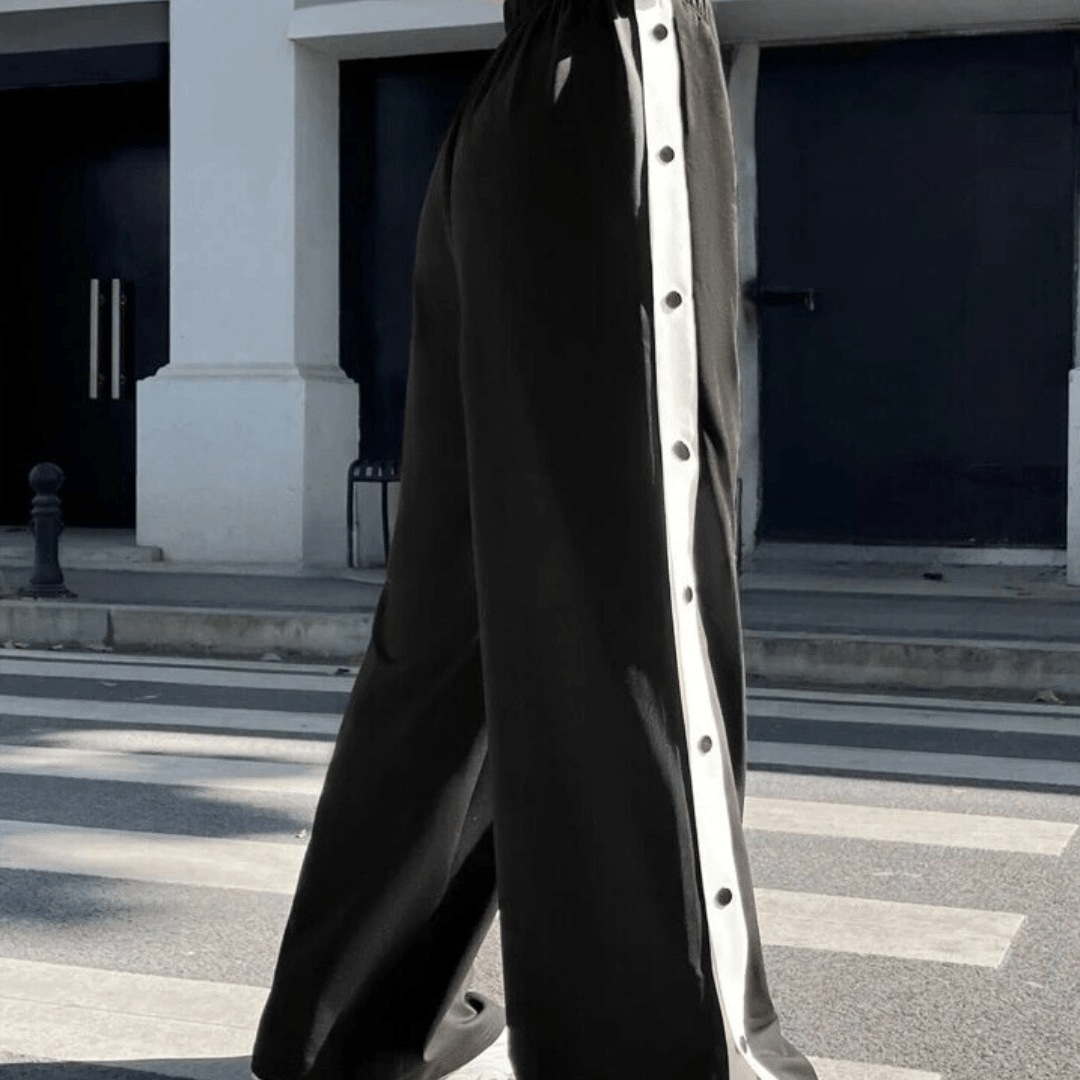 Trousers with side buttons and stripes