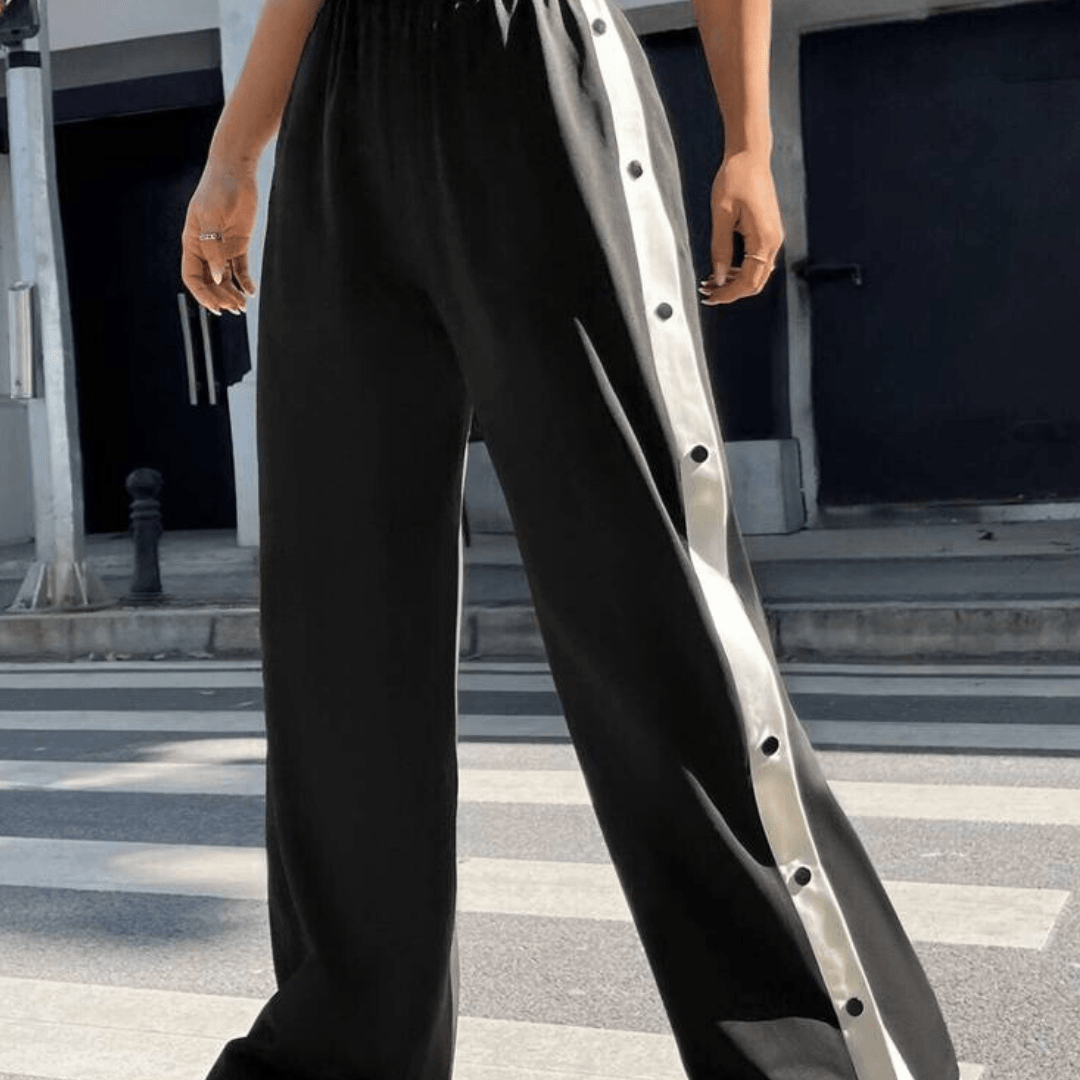 Trousers with side buttons and stripes