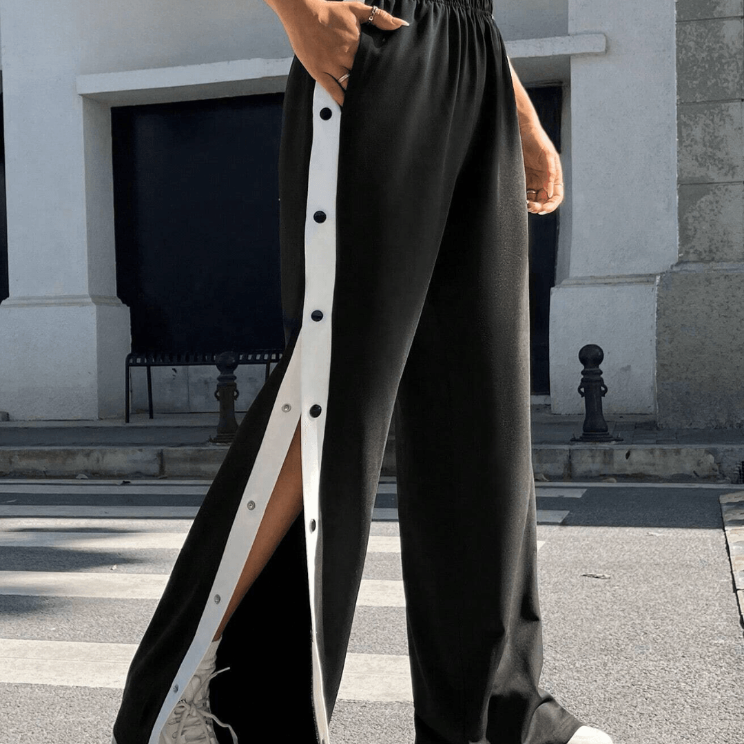 Trousers with side buttons and stripes